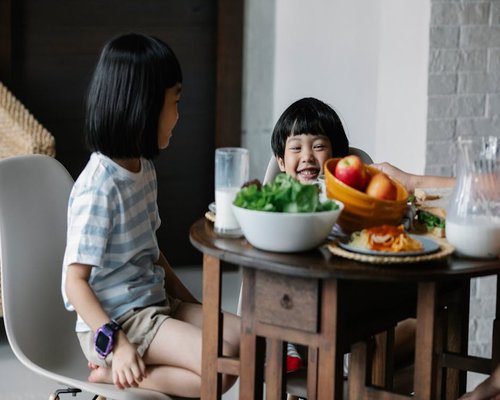Fresh tropical fruit salad bowl on wooden table
